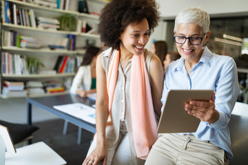 Group of successful business people at work in office