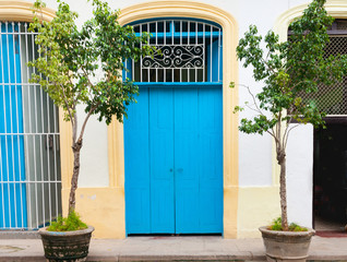 Blue doors on city street.