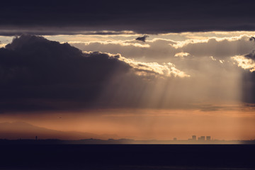 Dramatic sunrise over the  Los Angeles skyline with light rays