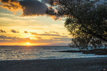 Obraz na płótnie Canvas Sunrise or sunset over sea surface