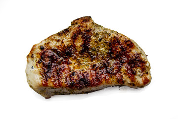 Isolated piece of grilled steak with spices