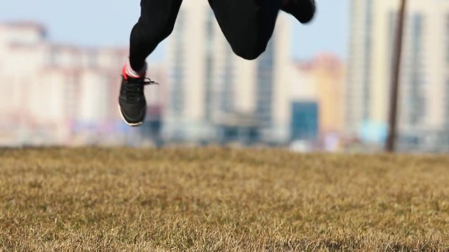 Young man performing acrobatic tricks in the air.