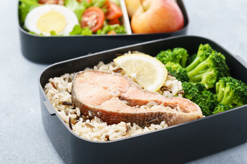 Various lunch boxes with healthy food and ingredients.