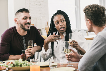 Group of diverse neighbors having conversation in social gathering party