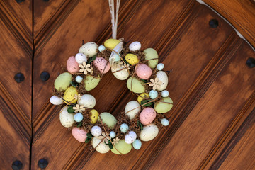 Easter egg wreath hangs on the door
