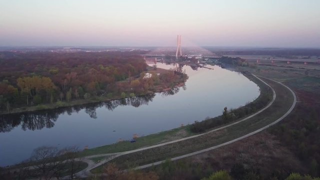 Aerial view of a bridge in lower silesia, Poland. Captured during sunrise on the outskirts of Wroclaw. Forward motion as seen from birds perspective.