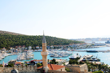 View of the city from the old Ottoman Cesme Castle. View of the Cesme marina - obrazy, fototapety, plakaty