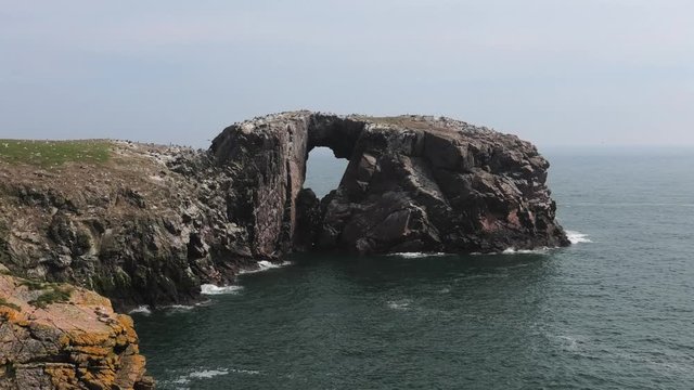 Medium shot of Bullers cliffs looking to Dunbuy arch