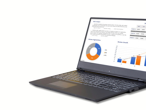 Computer notebook with business development analysis on screen