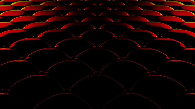 3D animation of the flight over a black quilted vinyl surface with red reflections of light.. Looped video