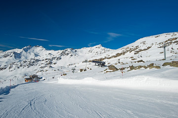 Landscape view of alpine mountainside with ski chair lift