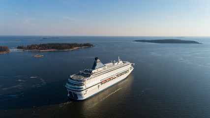 Aerial view of cruise liner sailing in the open sea at sunset