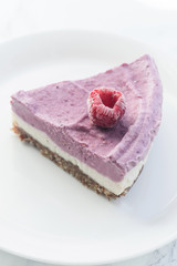 Raw cashew cake with raspberries. Sugar, milk and gluten-free dessert