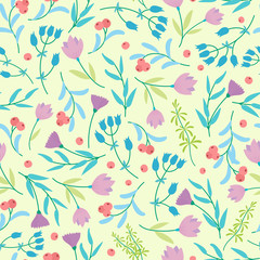 Cute abstract seamless pattern with small colorful flowers on the yellow