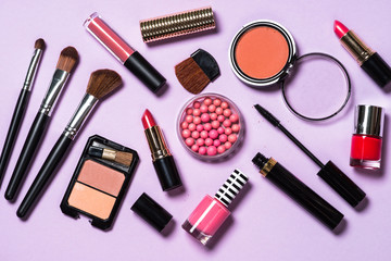 Obraz na płótnie Canvas Makeup professional cosmetics on purple background. 