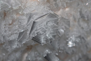 skeletal ice crystal in the form of a curl closeup