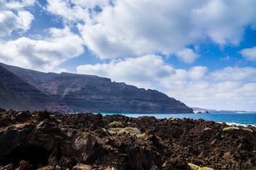 Fototapeta na wymiar Spain, Lanzarote, Rough solidified lava field at famara massif at north coast of the island