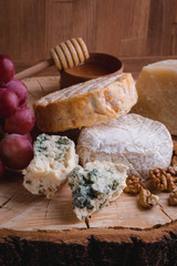 cheese plate on a wooden table. rustic