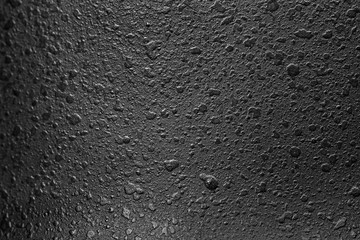 roughly painted black metal fragment super macro