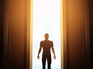 Man standing in front of mysterious open door