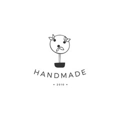 Vector logo template with a handmade topiary tree. Hand drawn isolated illustration.