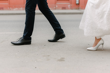 Feet of the bride and groom at a wedding