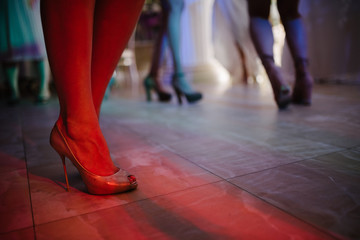 Fototapeta premium Feet of the bride and groom at a wedding
