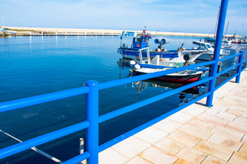 Italy, Marina di Ostuni, boat moored in the harbor.