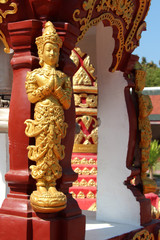 Fototapeta premium statue of a divinity in a buddhist temple (Wat Phra That Haripunchai) in Lamphun (Thailand)