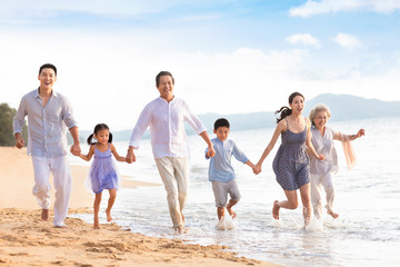 Happy family having fun on beach