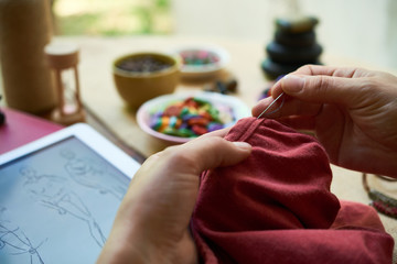 Woman sewing by hand