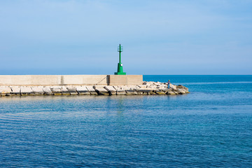Fototapeta na wymiar Italy, Marina di Ostuni, view of the entrance to the port.