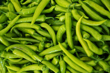 Green chilli pepper background.