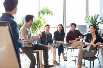 Young abroad students talking in seminar