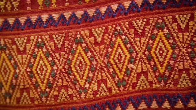 Hand made Thai fabric, Thai traditional fabric, Red fabric. (Panning)