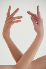 Beautiful twisted the hands of the dancers . Closely