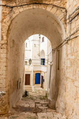 Fototapeta na wymiar Italy, Ostuni, a typical street in the ancient historic center