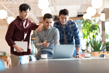 Young abroad students using laptop
