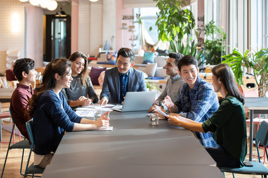 Young abroad students talking with teacher