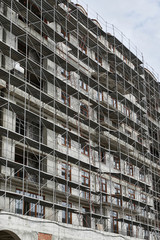 new building under construction, scaffolding and concrete