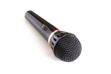 Black microphone on white background