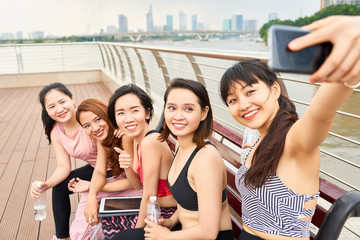 Fitness women making selfie portrait