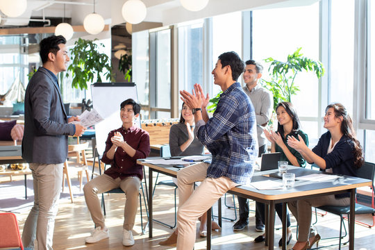 Young abroad students applauding in seminar