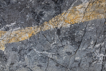 texture, background, rock with ocher-colored inclusion
