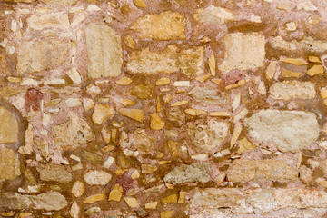 The background old brown stony wall