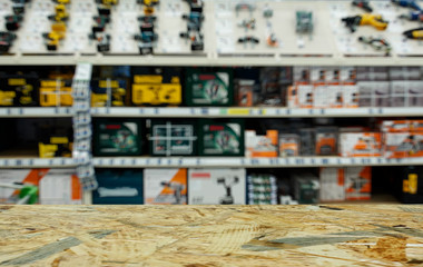 Obraz premium Shop for selling electric tools. Drills, screwdrivers, electric saws, grinder. Defocused, blurred image.