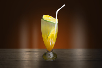 close up orange juice on the wooden table 