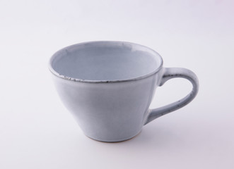 Pottery cup still life white background