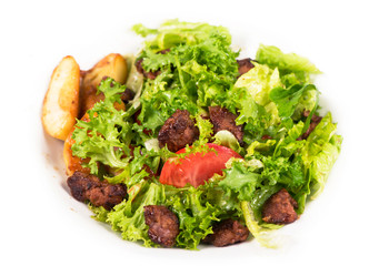 salad with chicken liver on the white plate