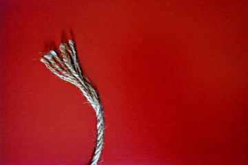 Minimalism on red background with rope